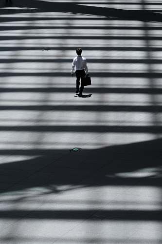 tokyo international forum man holding laptop bag walking on street chiyoda-ku